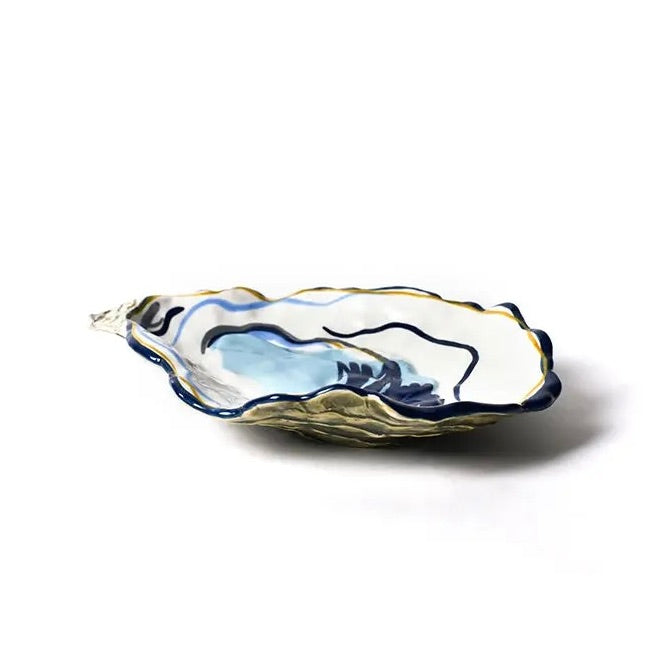 Decorative ceramic dish with blue and gold accents on a white background