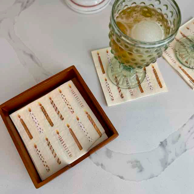 Set of coasters with a glass of beer on a marble surface