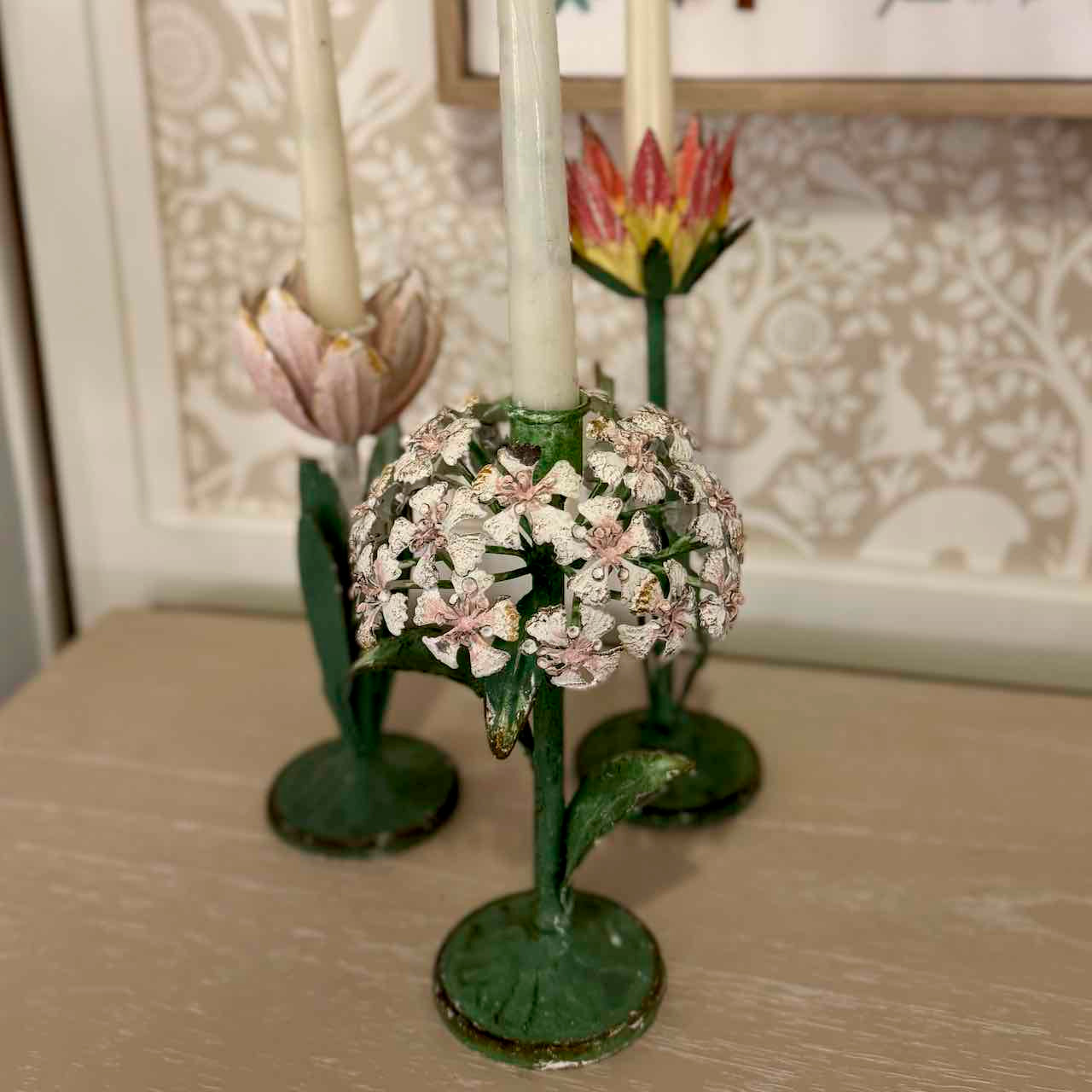 Decorative candle holder with floral design on a table