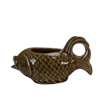 Ceramic fish-shaped planter on a white background