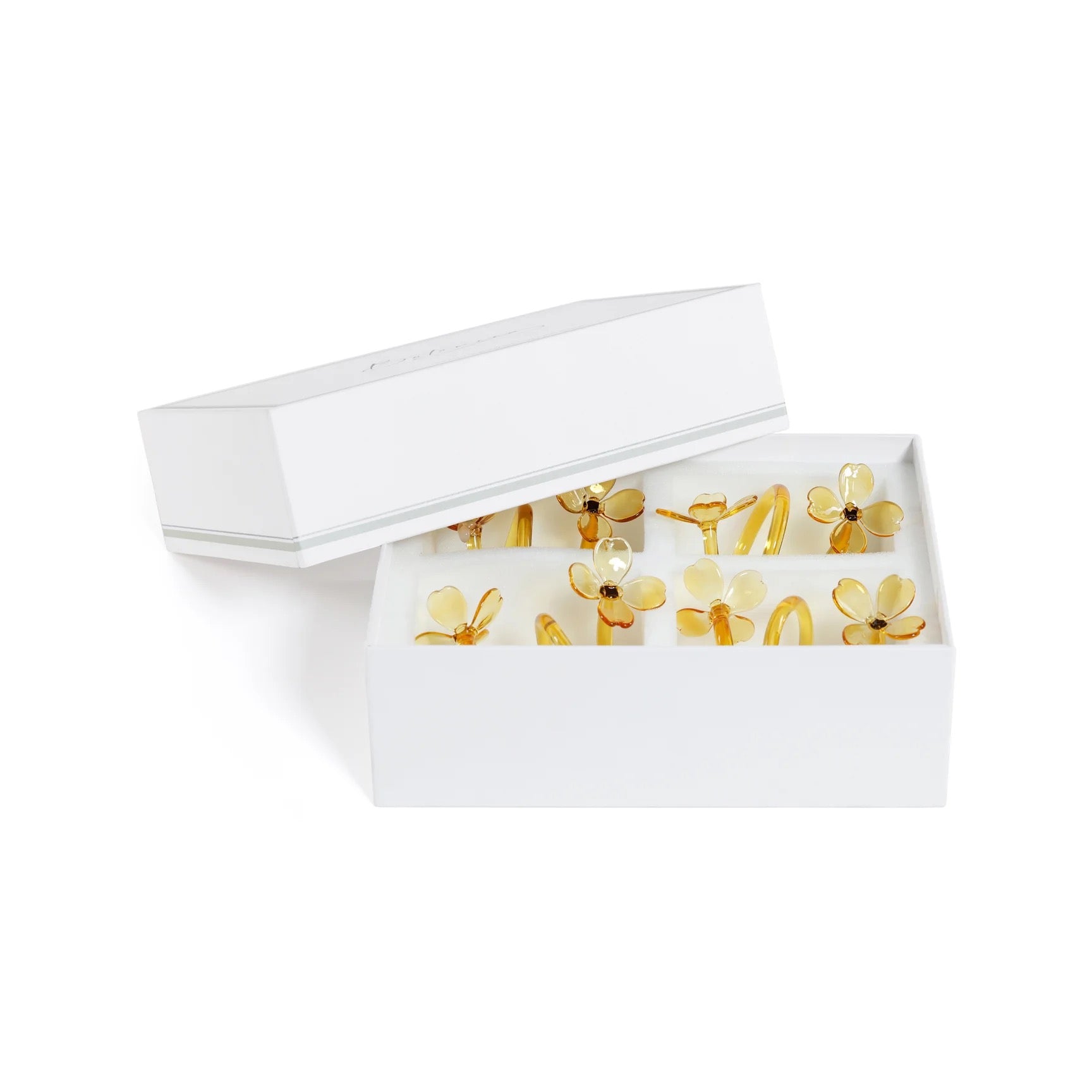 White hairband with yellow floral design on a white background