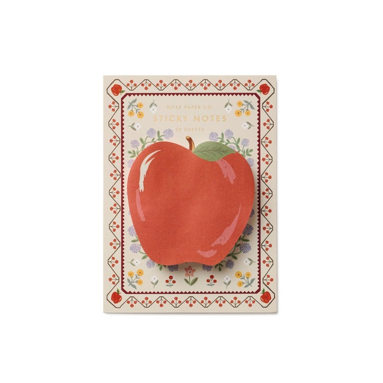 Notepad with a red apple illustration on a decorative border