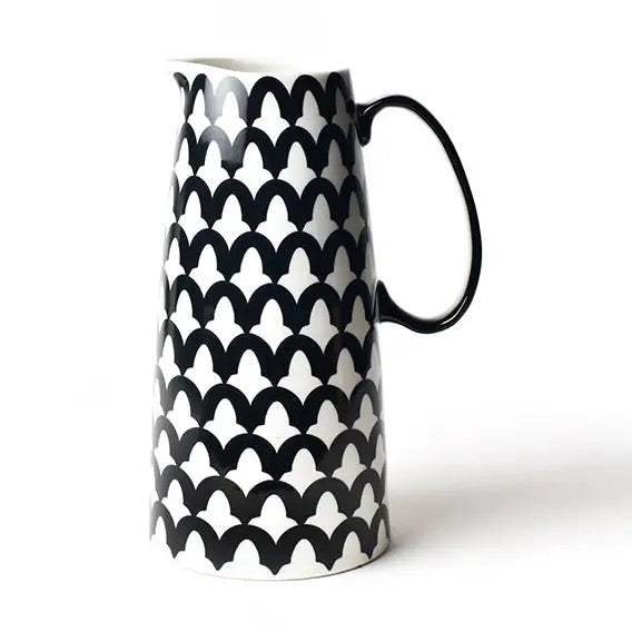 Black and white patterned ceramic pitcher on a white background