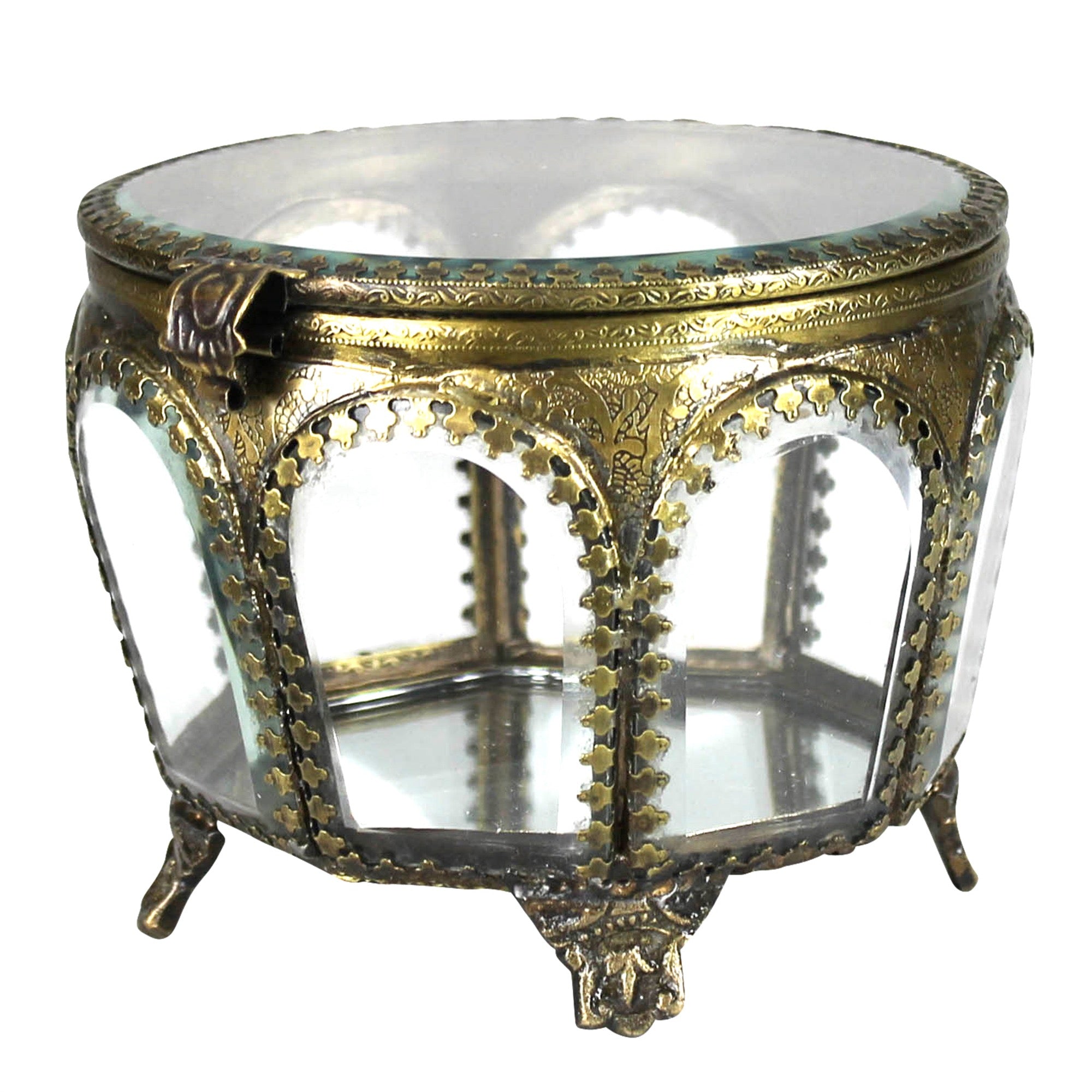 An ornate round glass display cabinet or side table with an antique brass frame, featuring decorative scrollwork, three arched glass panels, a top lid, and three small feet on a white background.