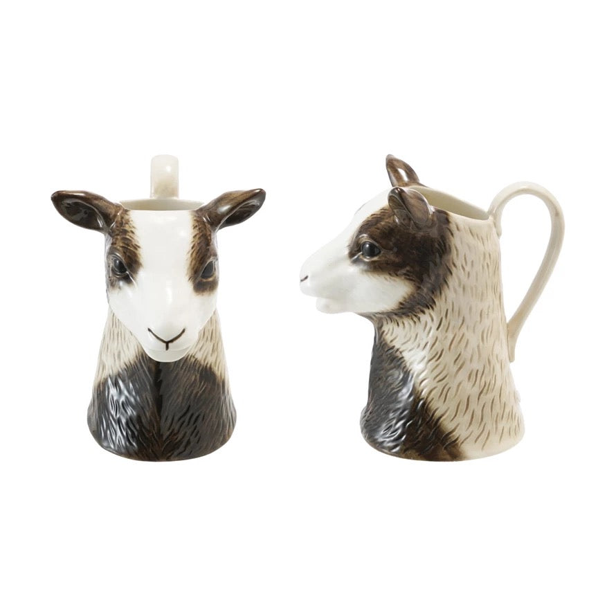 Ceramic salt and pepper shakers shaped like sheep on a white background