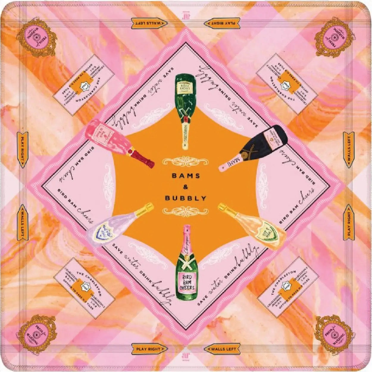 A square decorative print or scarf-like design featuring a pink and orange abstract background with a central diamond motif. The design includes illustrated champagne bottles, small cards, and repeated text such as 'BAMS & BUBBLY' and 'PLAY MUSHROOMS,' arranged in a symmetrical pattern.
