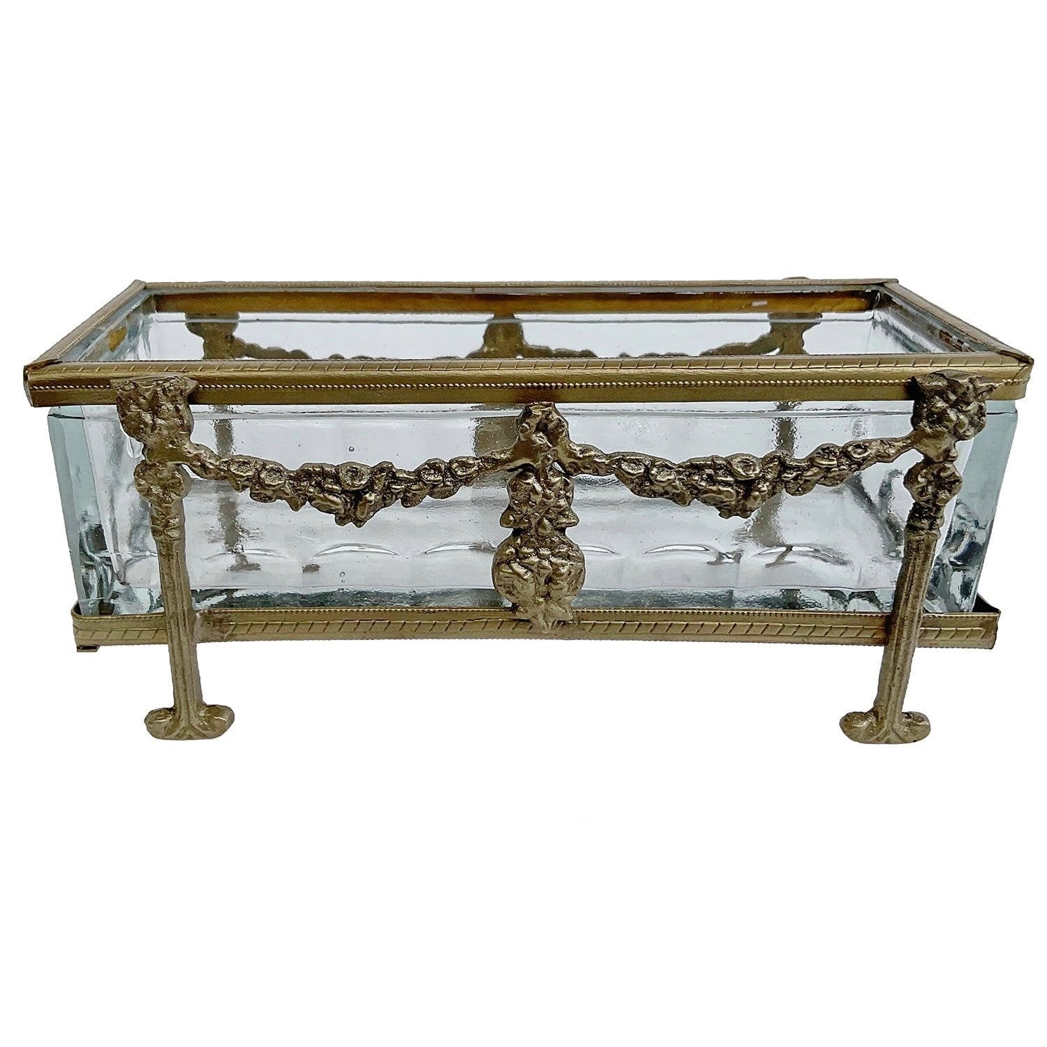 Decorative glass box with gold metal frame on a white background