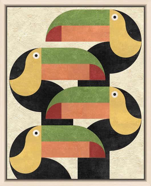 A framed art print featuring a stylized, geometric depiction of four toucans in a retro block pattern. The artwork uses a textured cream background with black, green, yellow, and terracotta shapes, enclosed in a light brown wood frame.
