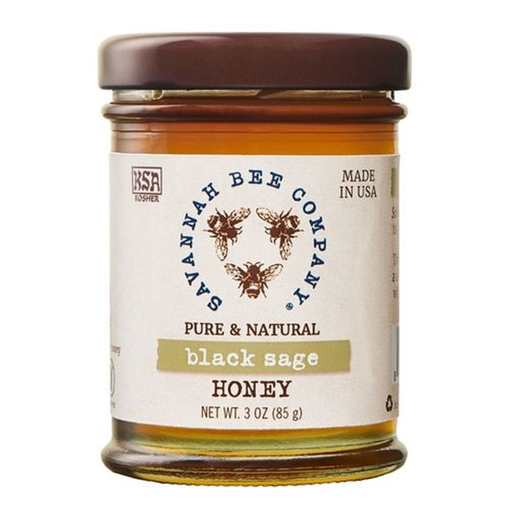Jar of Savannah Bee Company black sage honey on a white background