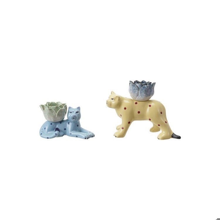 Two ceramic animal figures with planters on a white background