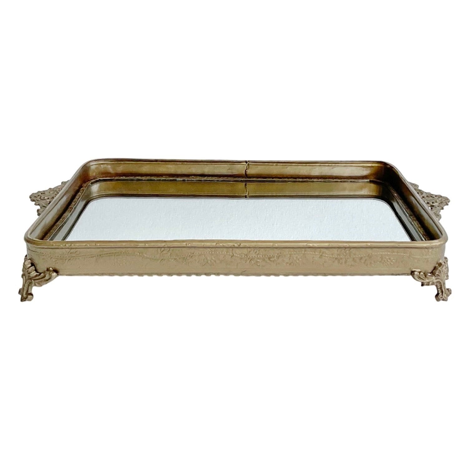 Decorative gold tray with a reflective surface on a white background