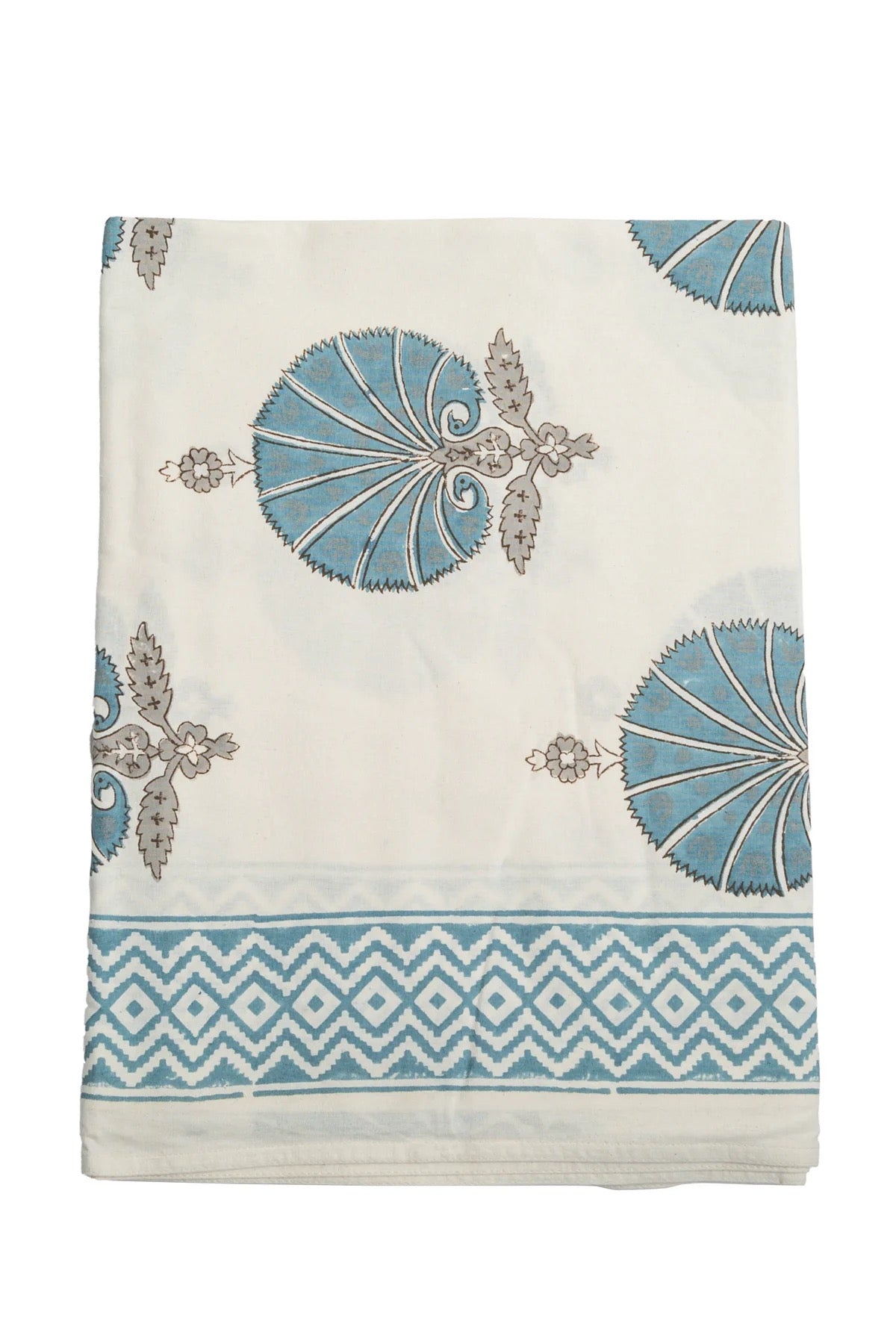 Decorative towel with blue and white patterns on a white background