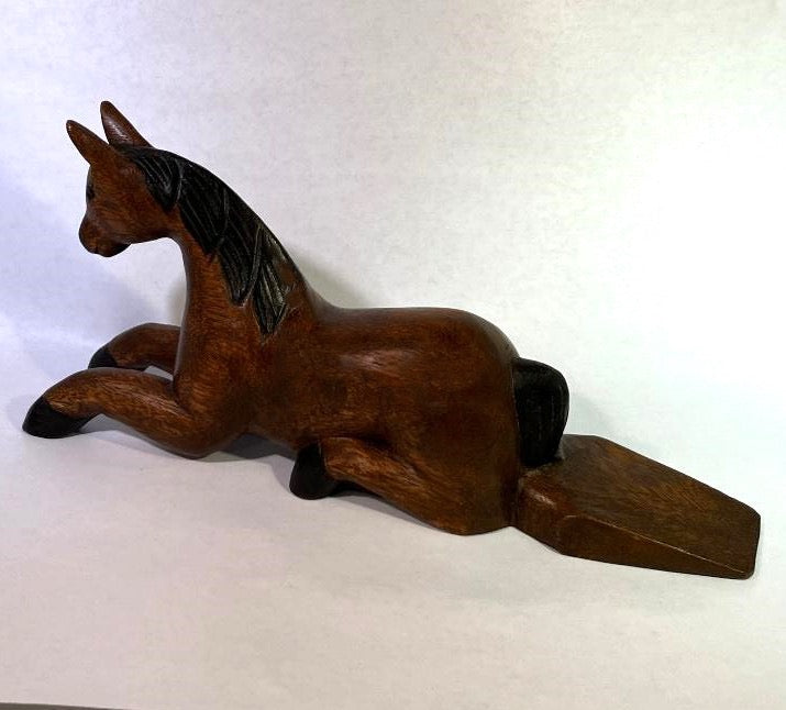 Wooden horse figurine on a white background