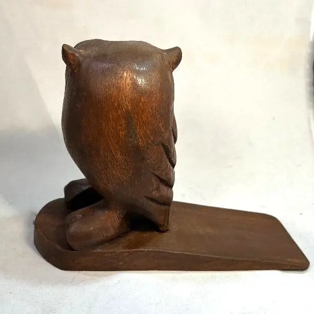 Wooden owl bookend on a white background