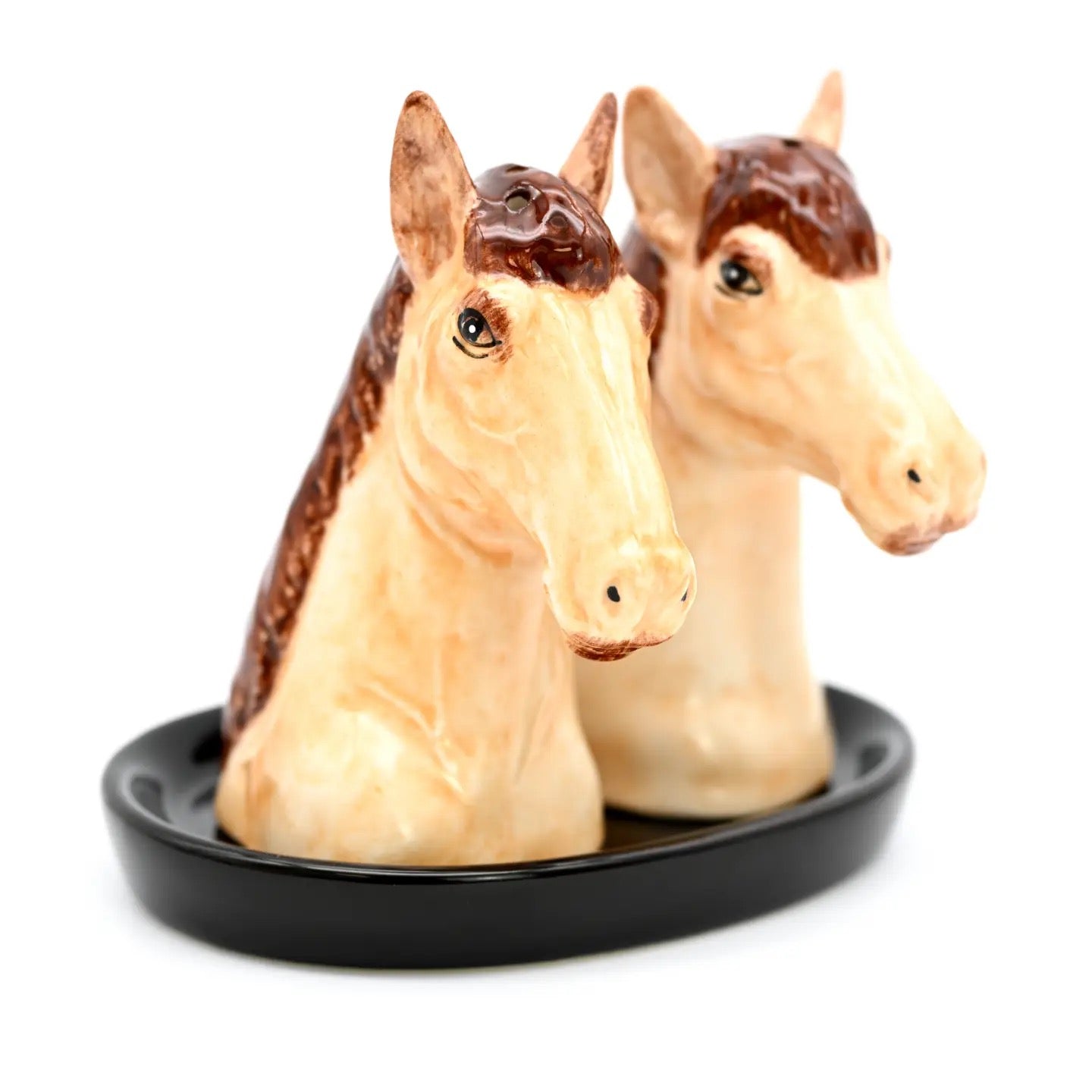 Horse-shaped salt and pepper shakers on a black base with a white background