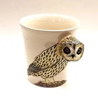 Ceramic mug with an owl design on a white background