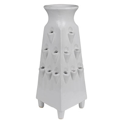 White ceramic vase with geometric design on a white background