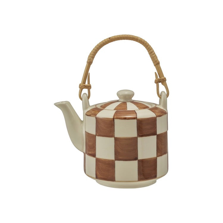 Teapot with checkered pattern and woven handle on a white background