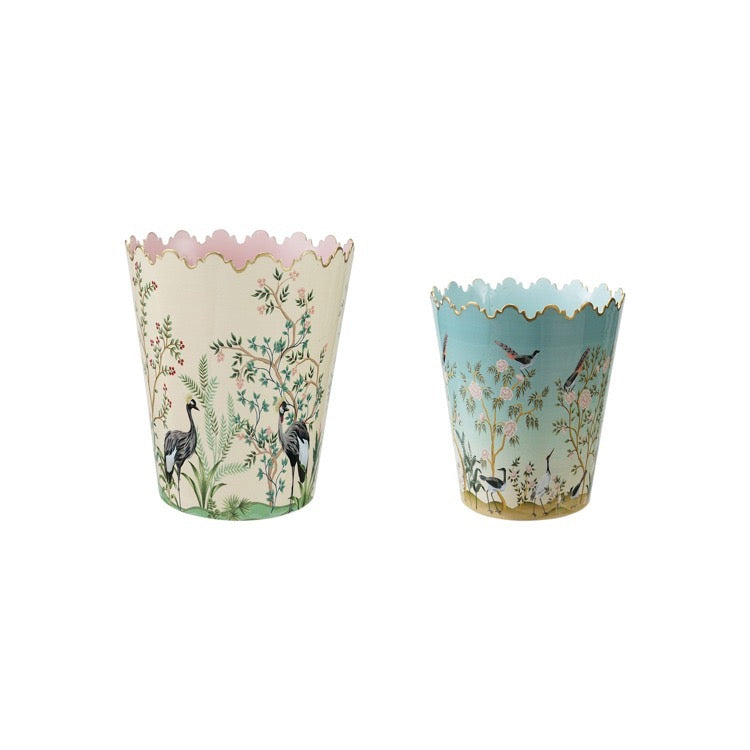 Two decorative paper cups with nature-themed designs on a white background
