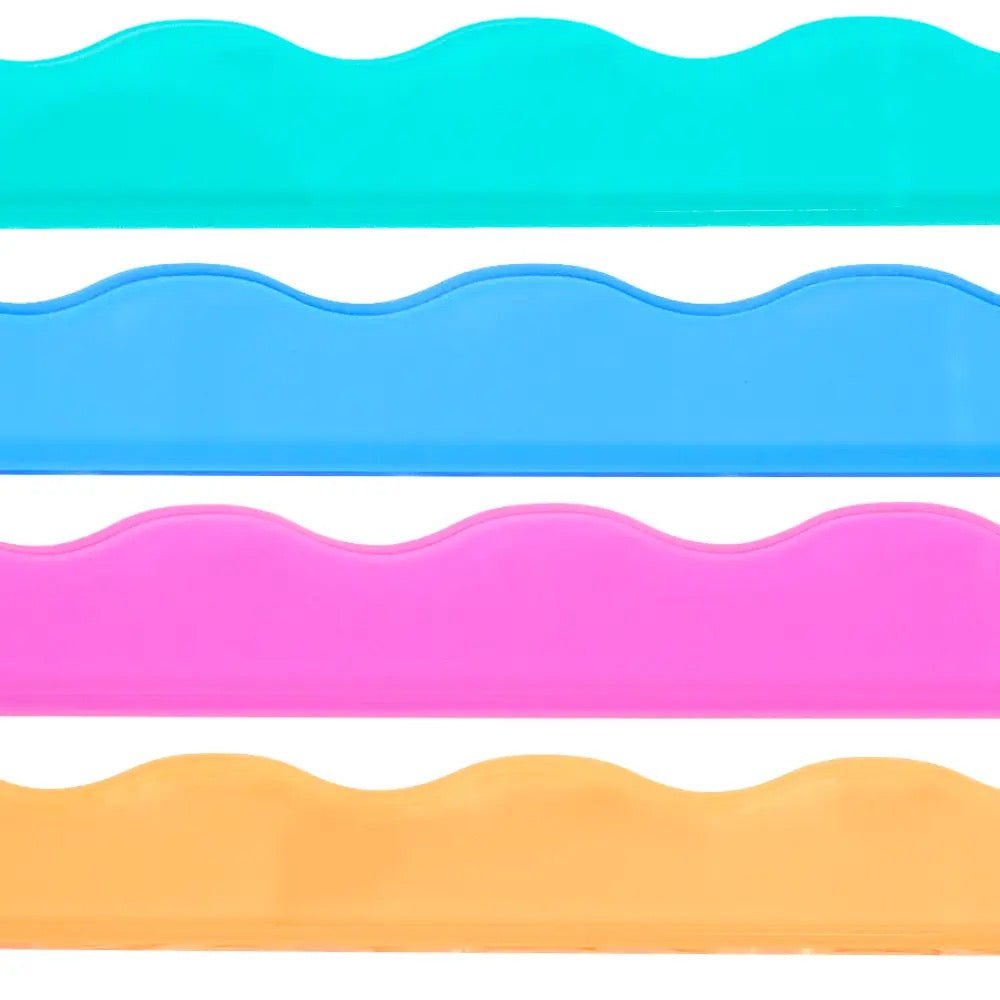Four wavy-edged plastic strips in turquoise, light blue, pink, and orange, arranged horizontally on a white background.