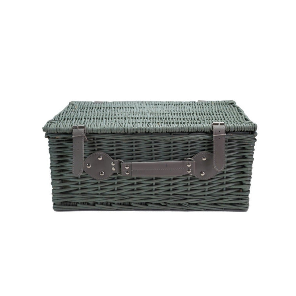 Wicker storage basket with a handle on a white background
