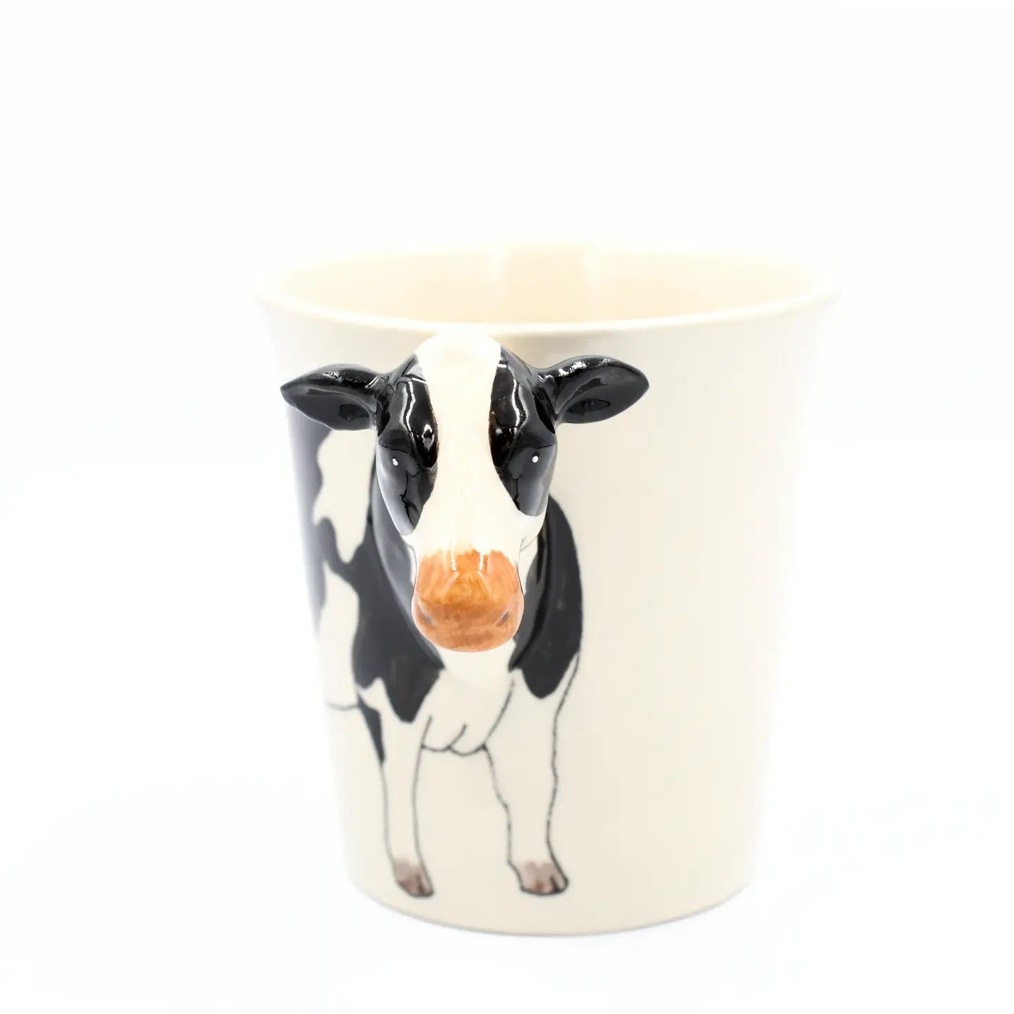 Ceramic mug with a cow design on a white background