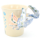 Ceramic mug with a colorful crab design on a white background