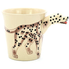 Mug shaped like a dalmatian dog with a handle on a white background