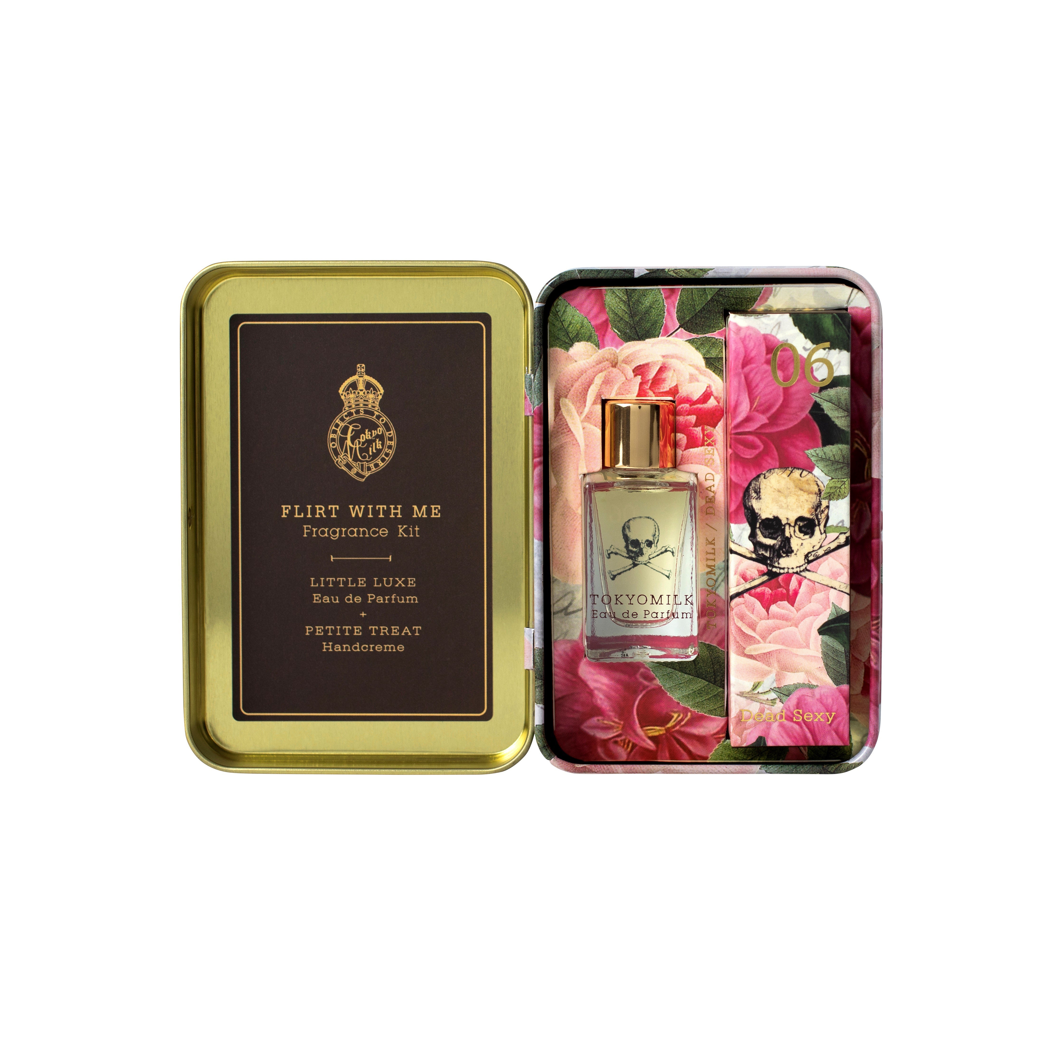 Perfume kit with a gold lid and floral design on the side