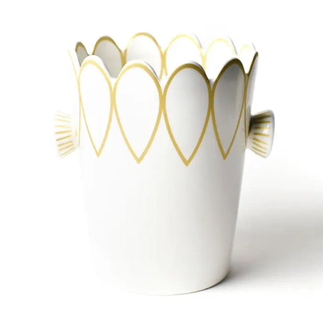 White vase with gold heart patterns on a white background