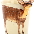 Ceramic mug with a deer design on a beige background