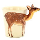 Ceramic mug shaped like a deer on a beige background