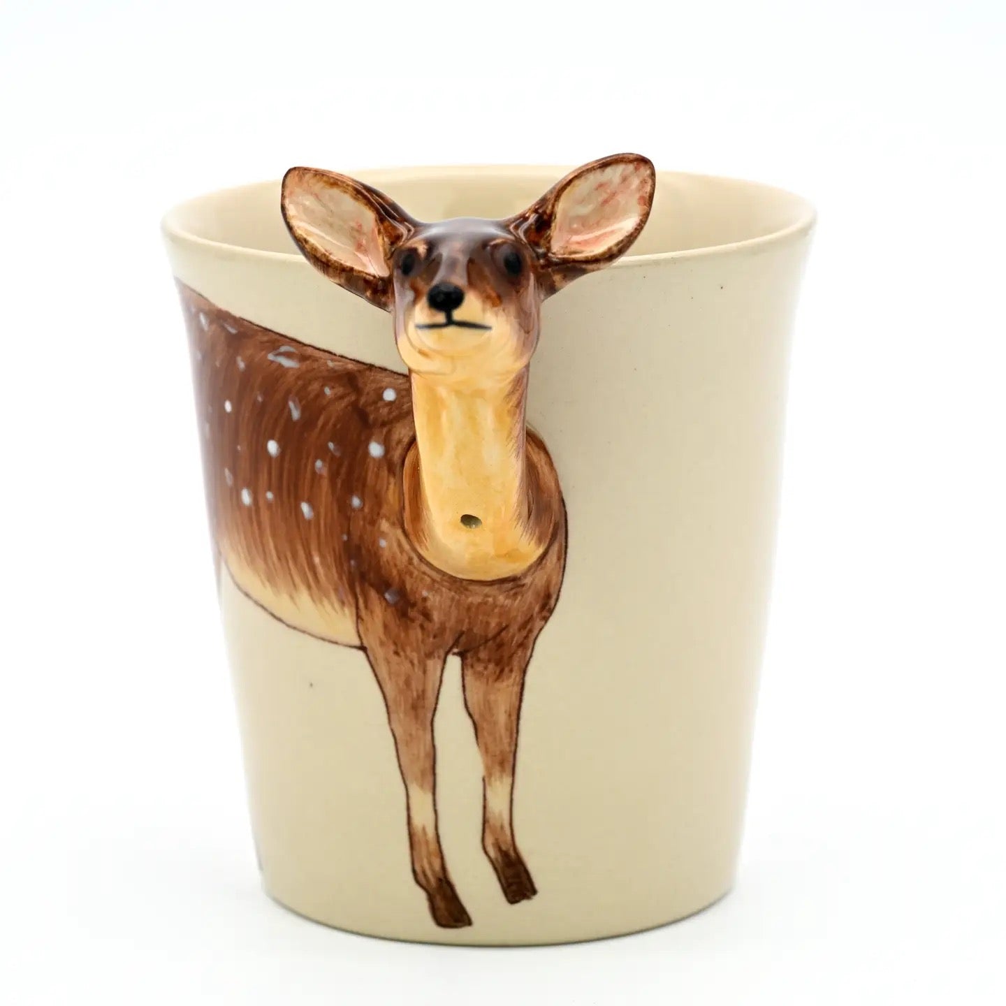 Ceramic mug with a deer design on a beige background