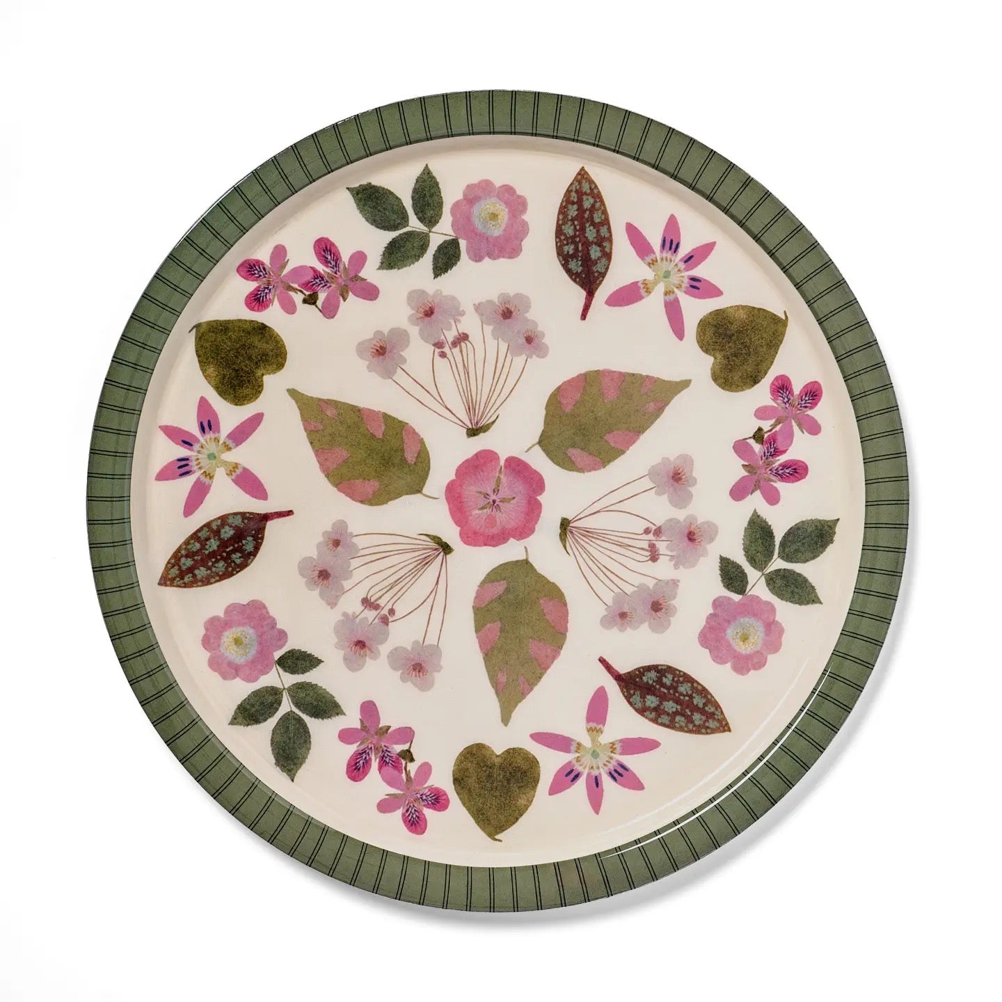 Round ceramic plate with floral and leaf pattern on a white background