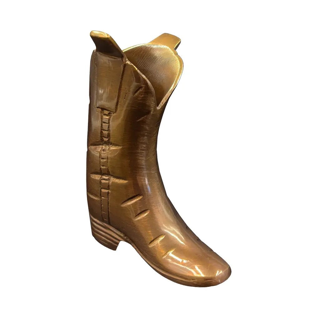 Gold cowboy boot on a white background