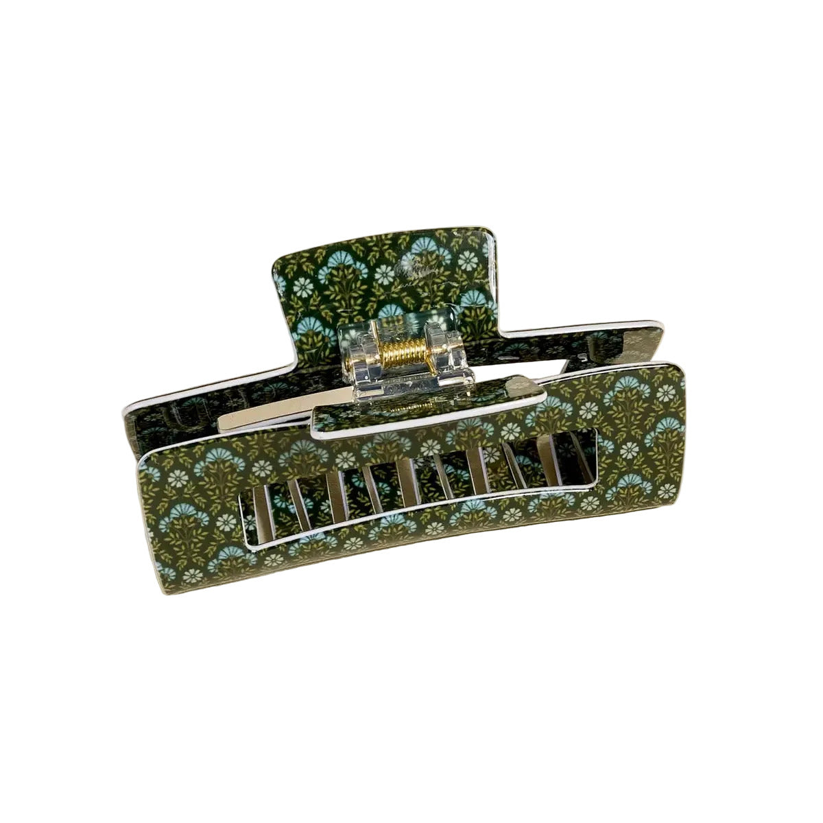 Floral patterned hair clip on a beige background