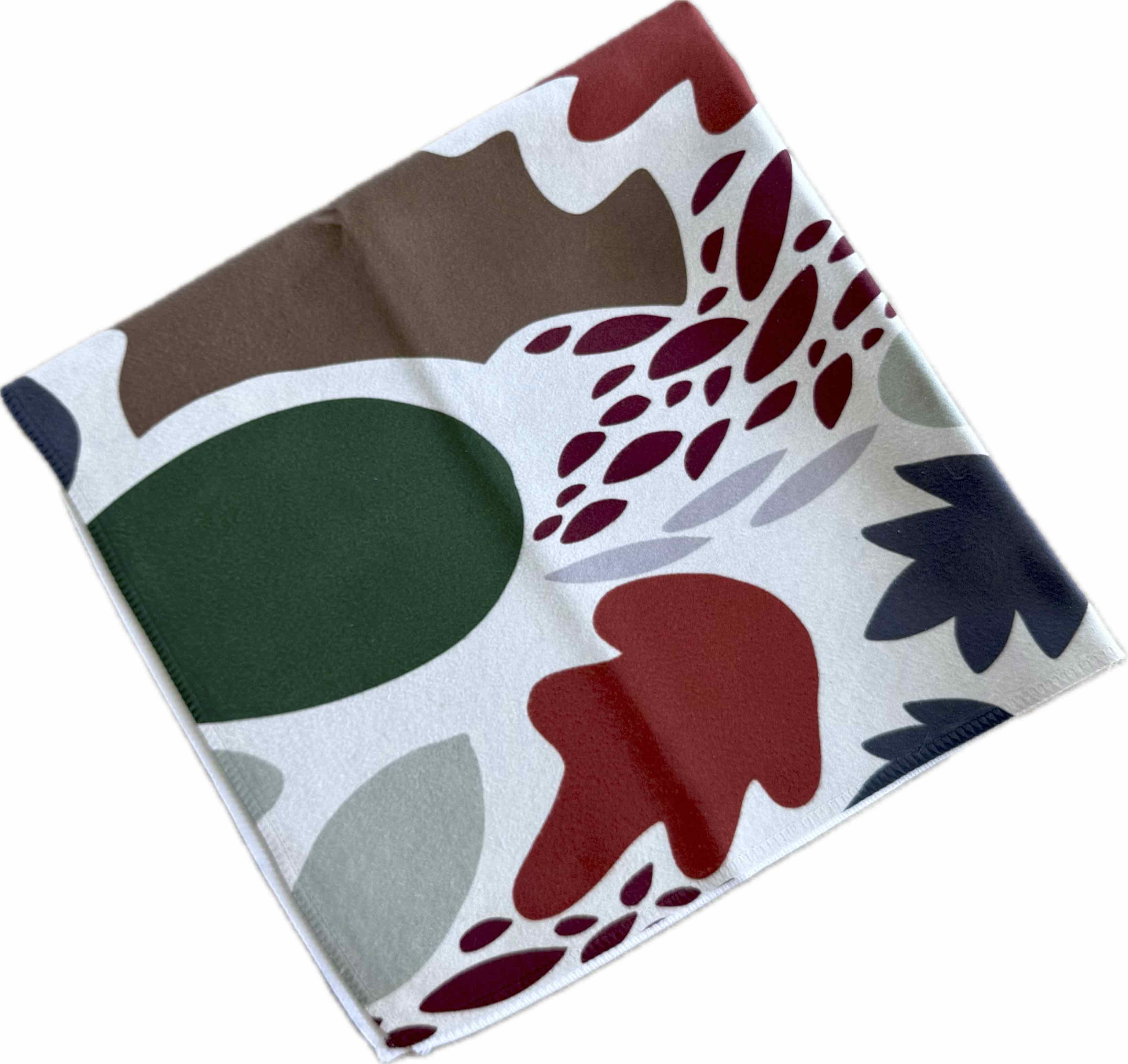 Colorful patterned fabric with abstract shapes on a white background