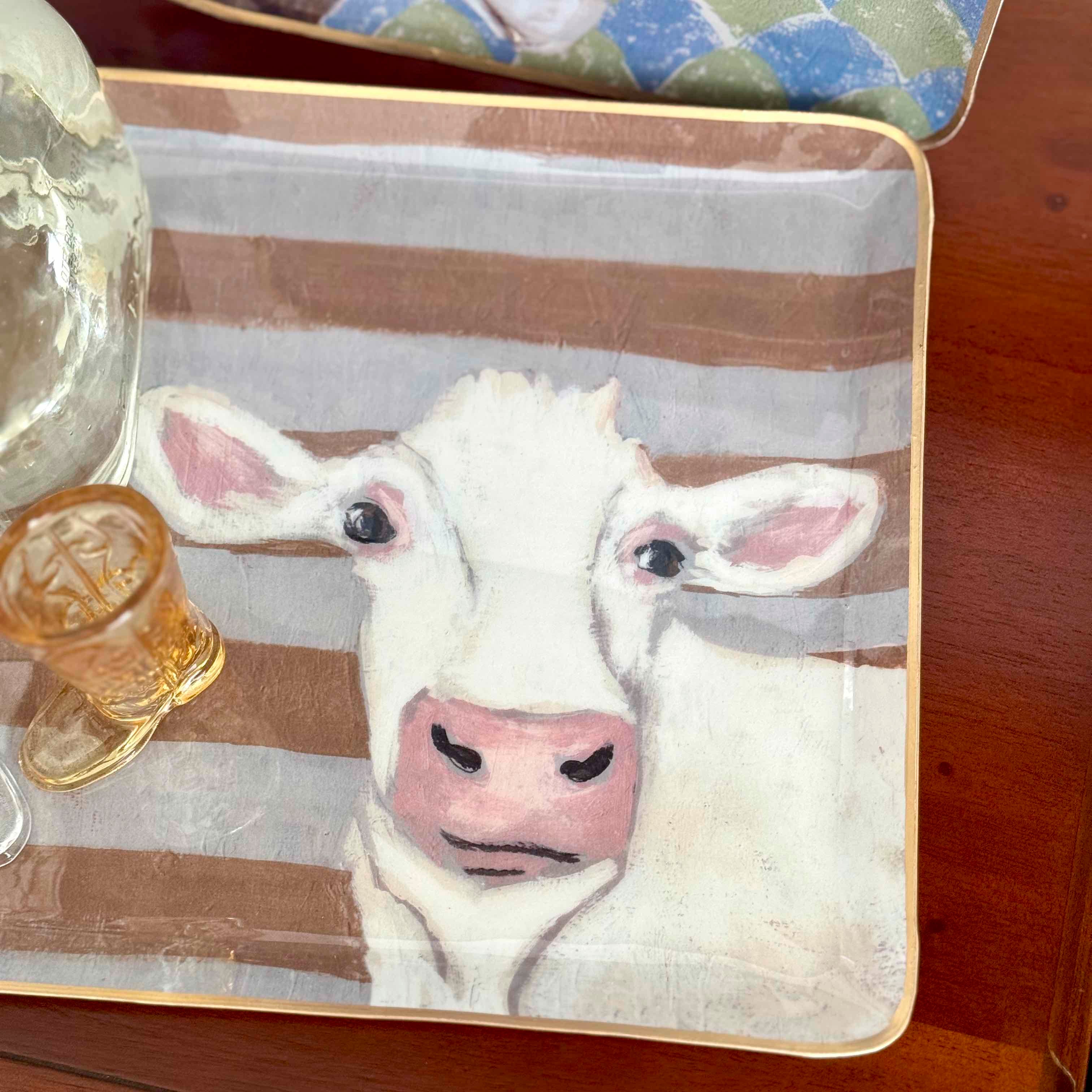Placemat with cow design on a wooden table