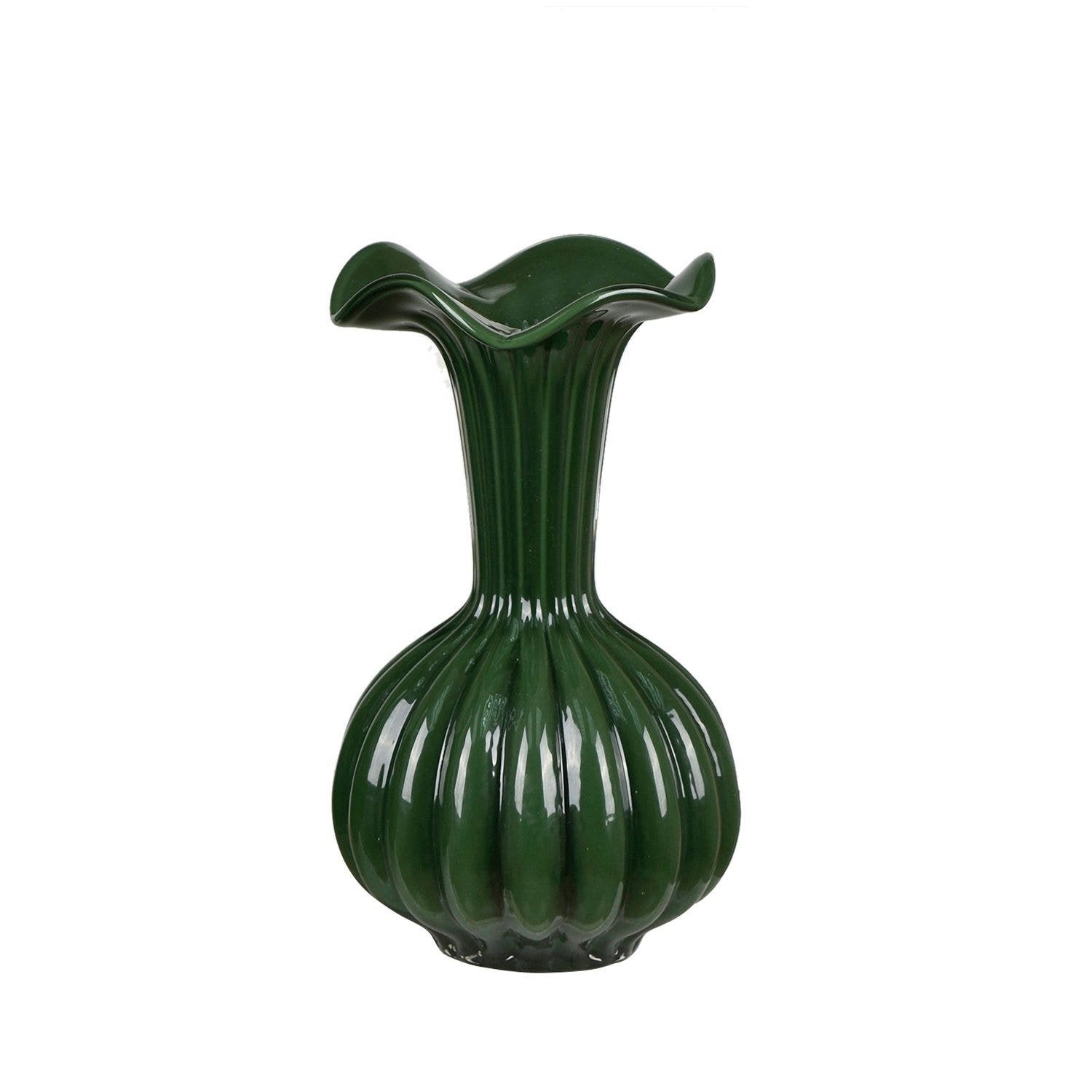 Green vase with ribbed design on a white background