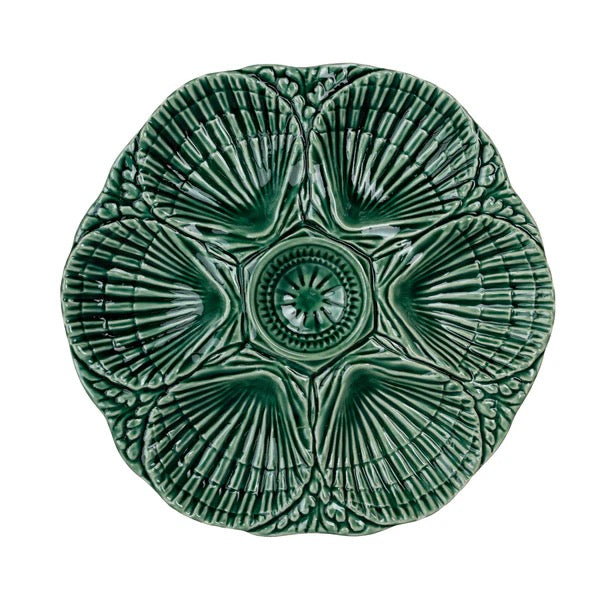 Green ceramic wall art piece with intricate patterns on a white background