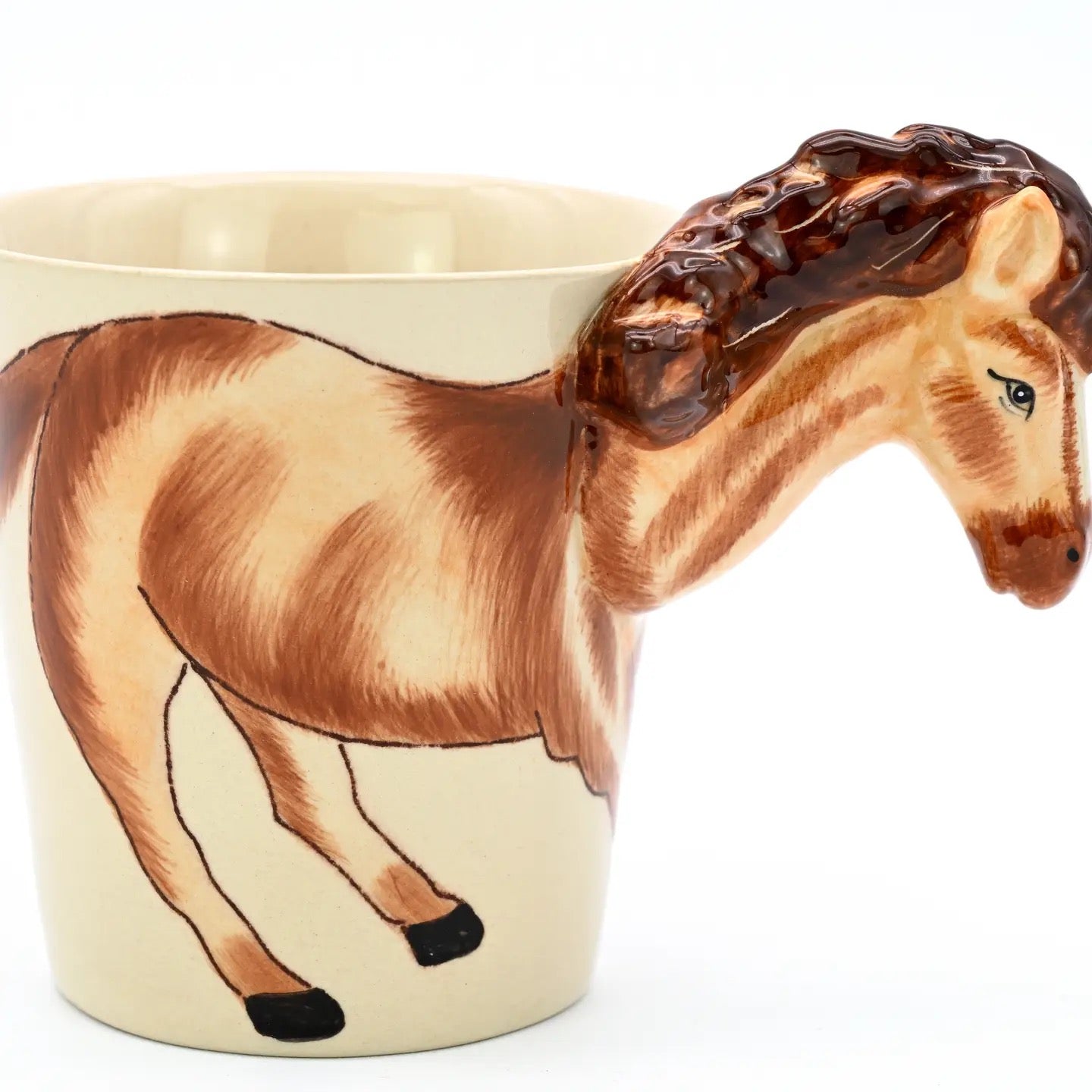 Ceramic mug shaped like a horse with a beige background