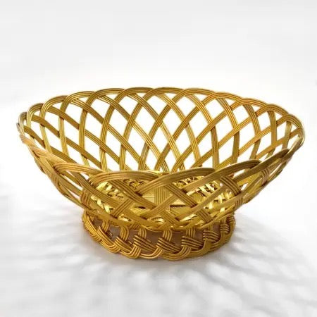 A golden metallic woven basket with a lattice pattern and a round base, shown on a white background with soft shadows.
