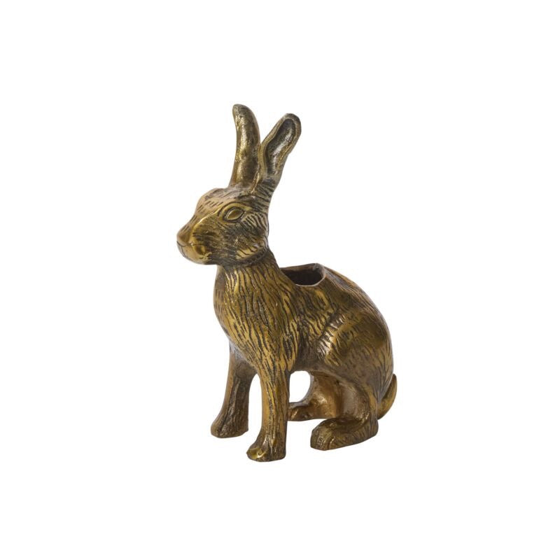 Bronze rabbit-shaped container on a white background