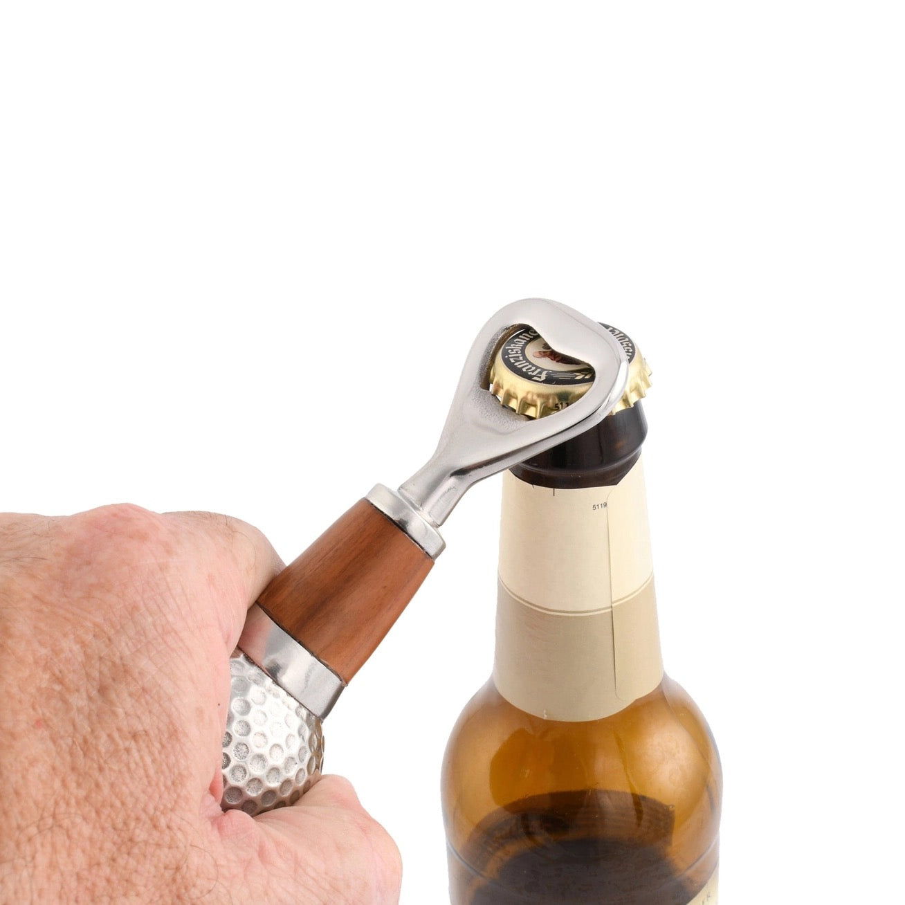 Hand using a unique bottle opener on a bottle with a white background