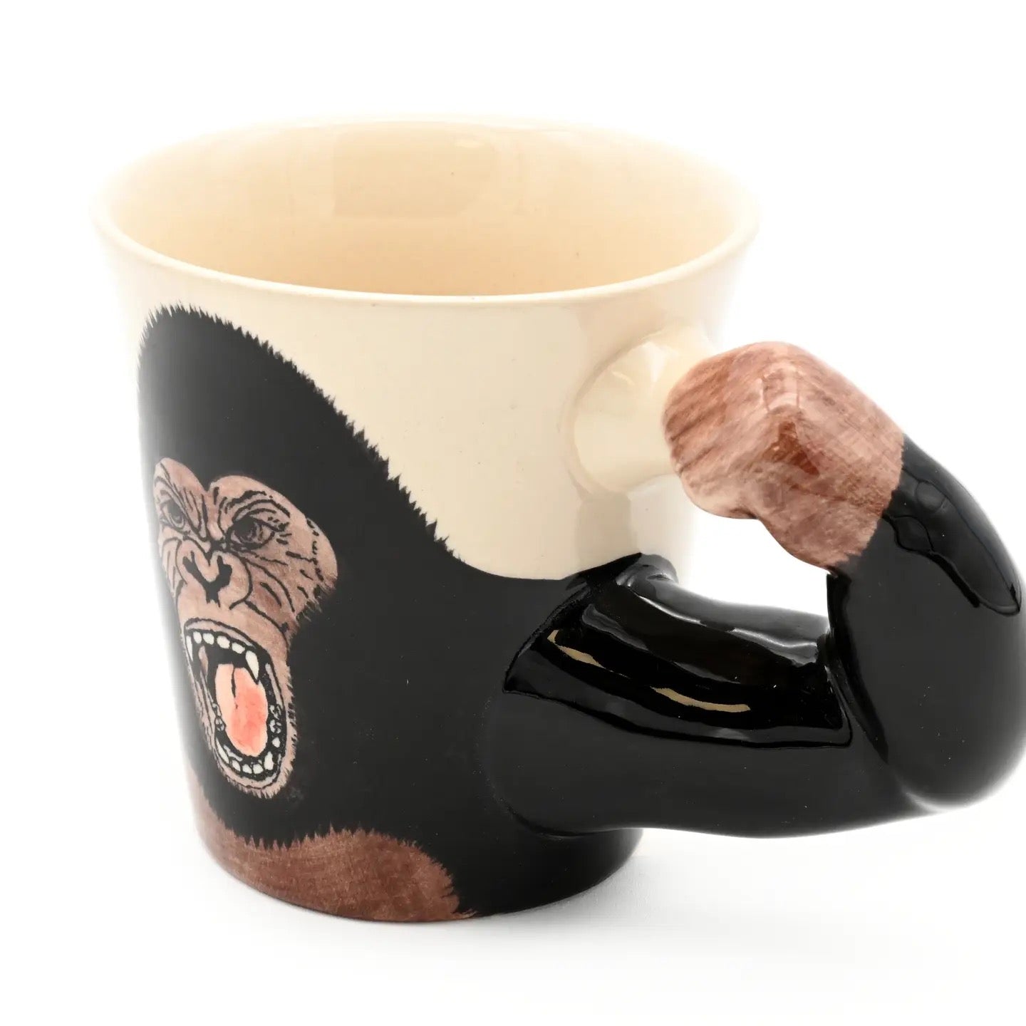 Mug with gorilla design and muscular arm handle on a white background
