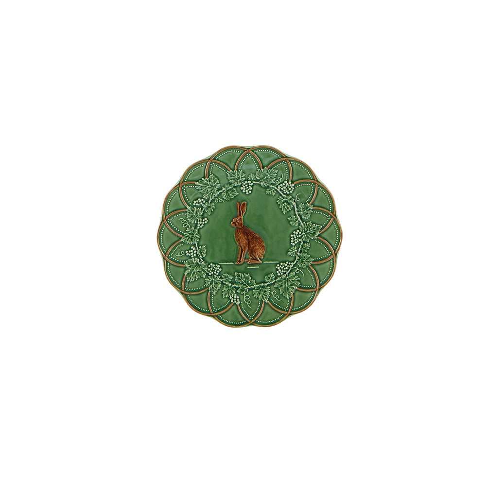 Decorative plate with a rabbit design on a green background
