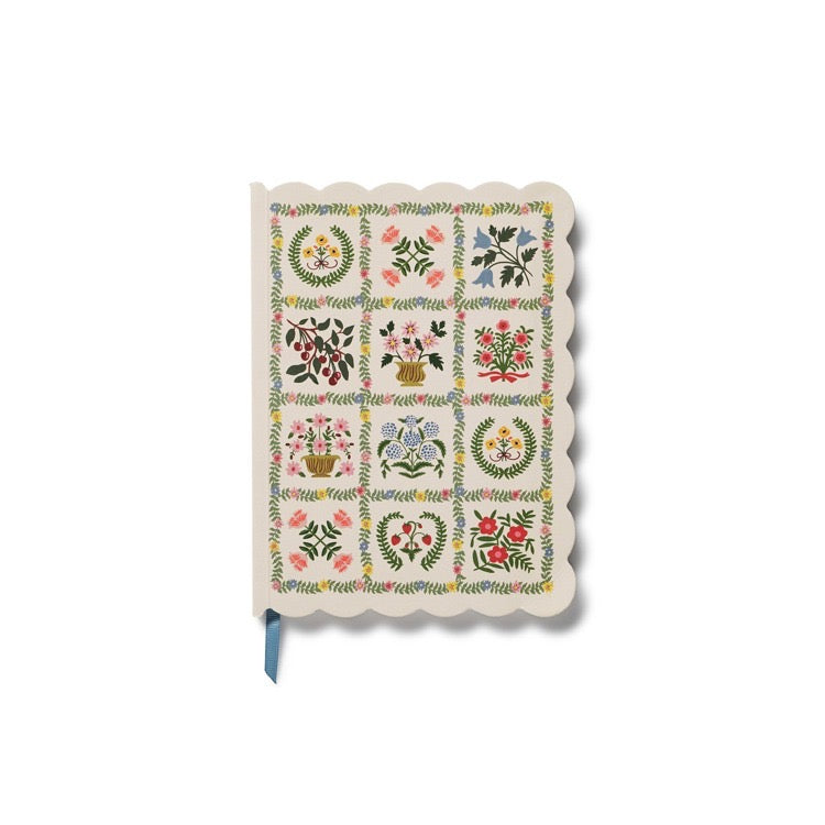 Notebook with floral pattern on a white background