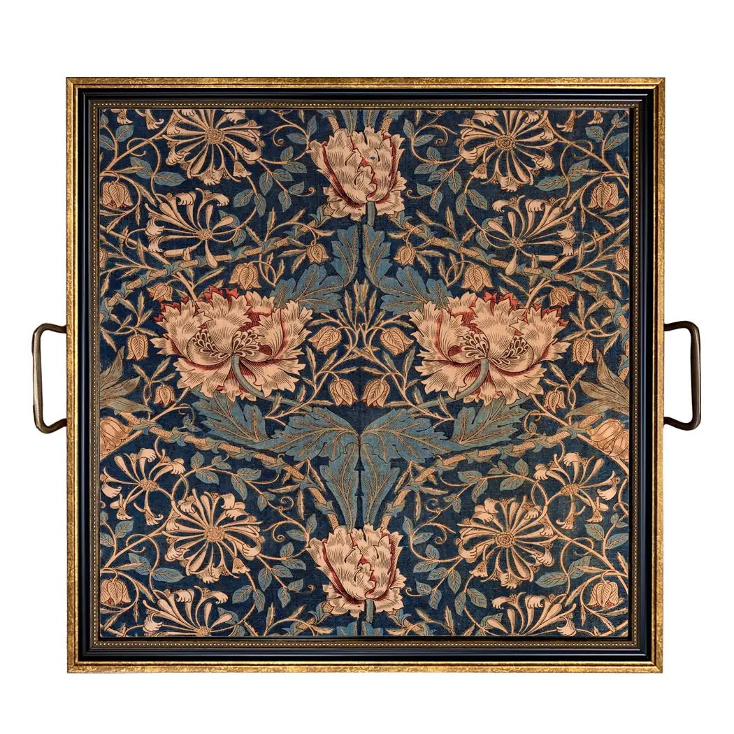 Decorative tray with floral pattern and gold handles on a white background