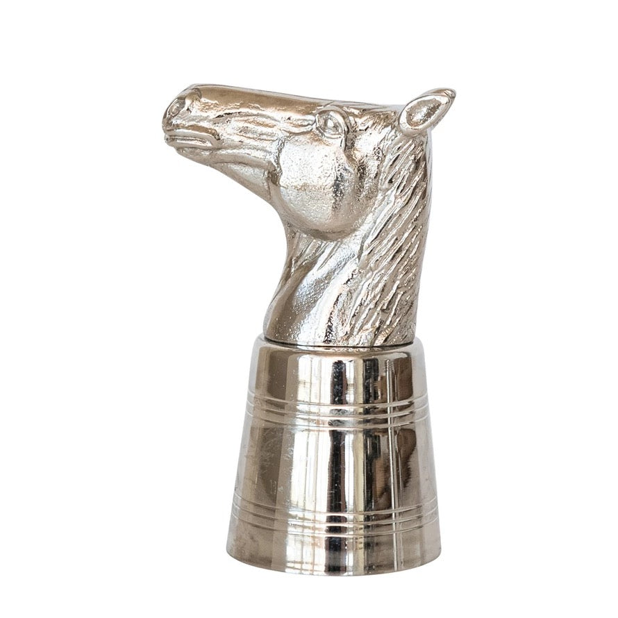 Silver horse head decanter stopper on a white background