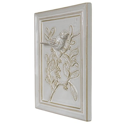 Decorative wall panel with bird and branch design on a white background